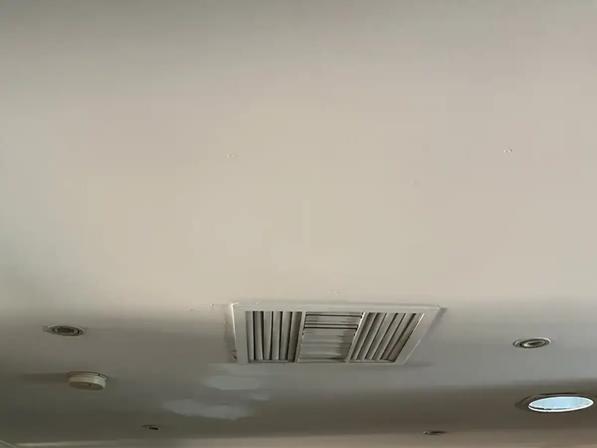 Before: a water-damaged living room ceiling in an Alice Springs home