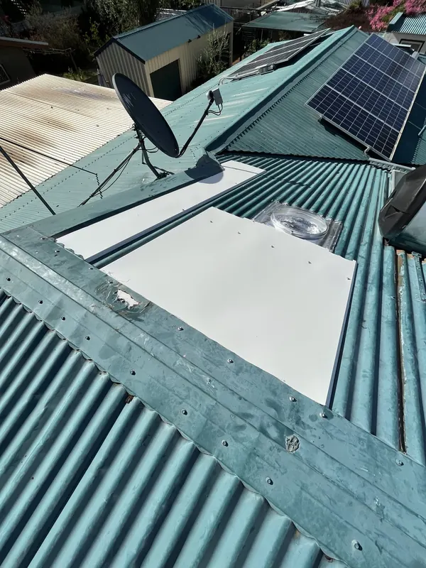 New roof sheet metal and the new skylight on the repaired roof