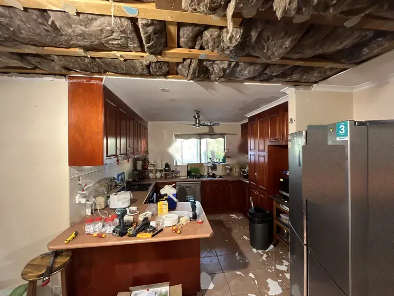 Ceiling down, roof frame and old insulation exposed